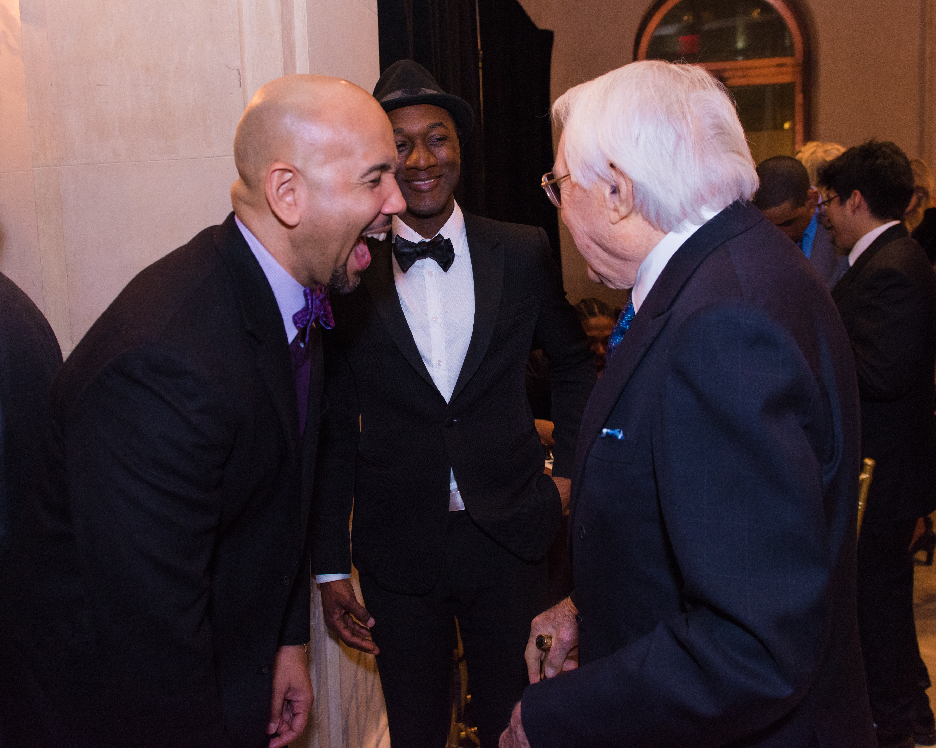 Bronx Borough President Ruben Diaz Jr. sharing a laugh with Aloe Blacc and Lewis B. Cullman.
